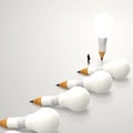 Businessman looking at 3d pencil and light bulb Royalty Free Stock Photo