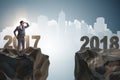 The businessman looking forward to 2018 from 2017 Royalty Free Stock Photo