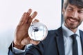 businessman looking at the glass globe in his hand . Royalty Free Stock Photo