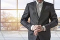 Businessman looking at his watch on his hand, watching the time in the office Royalty Free Stock Photo