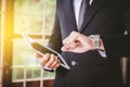 Businessman looking at his watch in office Royalty Free Stock Photo