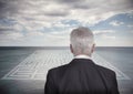 Businessman looking at landscape and maze