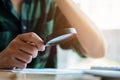 Businessman looking through a magnifying glass to documents. Business assessment and audit. Magnifying glass on a financial report