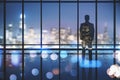 Businessman looking out of window in clean empty office interior Royalty Free Stock Photo