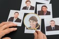 Businessman looking at photograph through magnifying glass Royalty Free Stock Photo