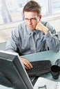 Businessman looking at screen in office Royalty Free Stock Photo