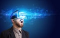 Businessman looking through Virtual Reality glasses, virtual security concept Royalty Free Stock Photo