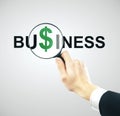 Businessman looks at a green dollar sign Royalty Free Stock Photo