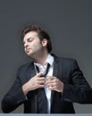 Businessman loosening tie Royalty Free Stock Photo