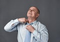 Businessman loosening his neck tie Royalty Free Stock Photo