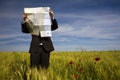 Businessman lost in field Royalty Free Stock Photo