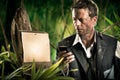 Businessman lost in jungle Royalty Free Stock Photo
