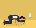 Businessman with low battery Ã¢â¬â¹indicator crawling to electric plug for charging his power