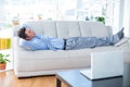 Businessman lying on couch Royalty Free Stock Photo