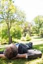 Businessman lying in park Royalty Free Stock Photo