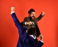 Businessman with mad face hits and punches opponent. Royalty Free Stock Photo