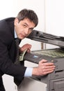 Businessman make false money on copy machine