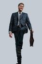 Businessman makes a new step. standing at the top. Royalty Free Stock Photo