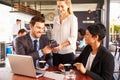 Businessman making contactless card payment in a cafe Royalty Free Stock Photo