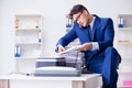 The businessman making copies in copying machine Royalty Free Stock Photo