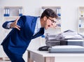 Businessman making copies in copying machine Royalty Free Stock Photo