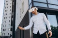 Businessman making gestures when wearing virtual reality goggles Royalty Free Stock Photo