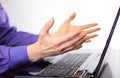 Businessman making hand gesture `come on` in front of laptop display. Royalty Free Stock Photo