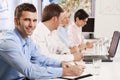 Businessman making notes on presentation