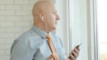 Businessman Making a Phone Call Using Cellphone Hands-free