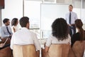 Businessman Making Presentation To Colleagues In Office Royalty Free Stock Photo