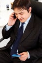 Businessman making purchase by phone and ca Royalty Free Stock Photo