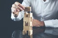 Businessman making a pyramid with empty wooden cubes Royalty Free Stock Photo