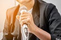 Businessman making speech with microphone. Royalty Free Stock Photo