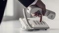 Dialing a phone number on a classical white landline device