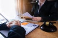 Businessman and Male lawyer or judge consult having team meeting with client, Law and Legal services concept. Royalty Free Stock Photo