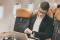 Businessman male looking at wrist watch for worry meeting late from flight delay Royalty Free Stock Photo