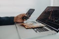 Businessman man counting euro money working on computer and smartphone at office desk, inflation concept. Royalty Free Stock Photo