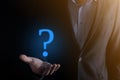 Businessman man hand hold interface question marks sign web. Ask quiestion online, FAQ concept, what where when how and why, Royalty Free Stock Photo