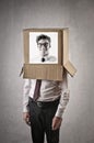 Businessman with a man's picture on a box on his head Royalty Free Stock Photo