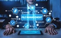 Businessman Managing Digital Files with Advanced Technology Interface Displaying Icons for File Management, Cloud Royalty Free Stock Photo
