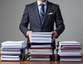 Businessman Managing Multiple Documents and Files in Office Setting Royalty Free Stock Photo