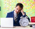 Businessman with many conflicting priorities in time management