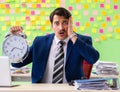 Businessman with many conflicting priorities in time management