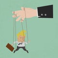 Businessman marionette on ropes controlled