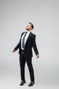 Businessman marionette in suit posing with