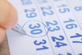 Businessman Marking Date On Calendar At Desk Royalty Free Stock Photo