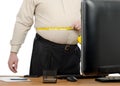 Businessman measures big waist by tape meter Royalty Free Stock Photo