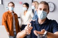 Businessman in medical mask spraying sanitizer Royalty Free Stock Photo