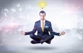 Businessman meditates with enlightenment concept Royalty Free Stock Photo