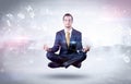 Businessman meditates with enlightenment concept Royalty Free Stock Photo